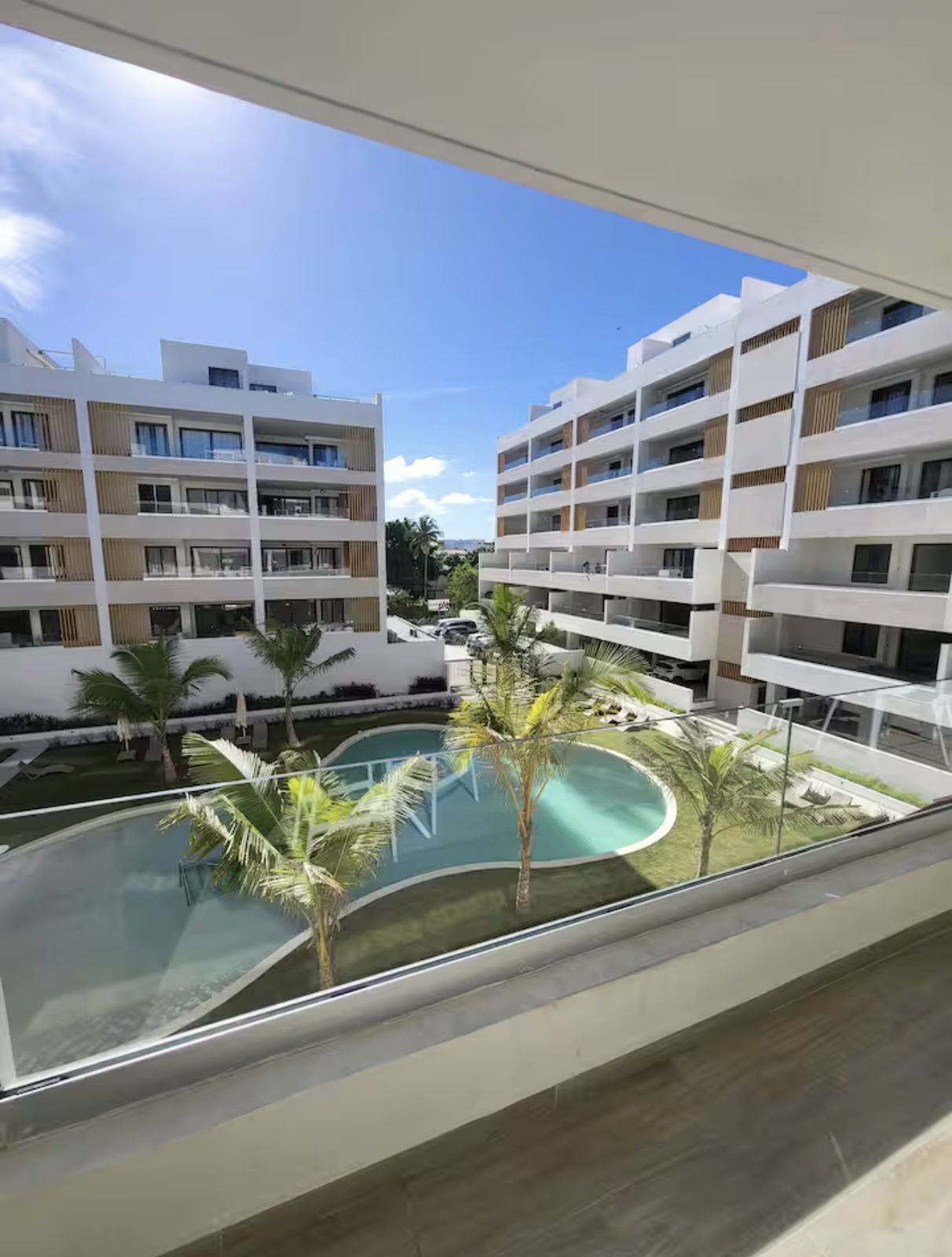 Balcony view over the pool at Airbnb 1, Los Corales